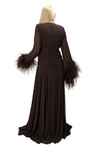 Elegant flared brown tulle gown with dramatic feather sleeves and high leg slit